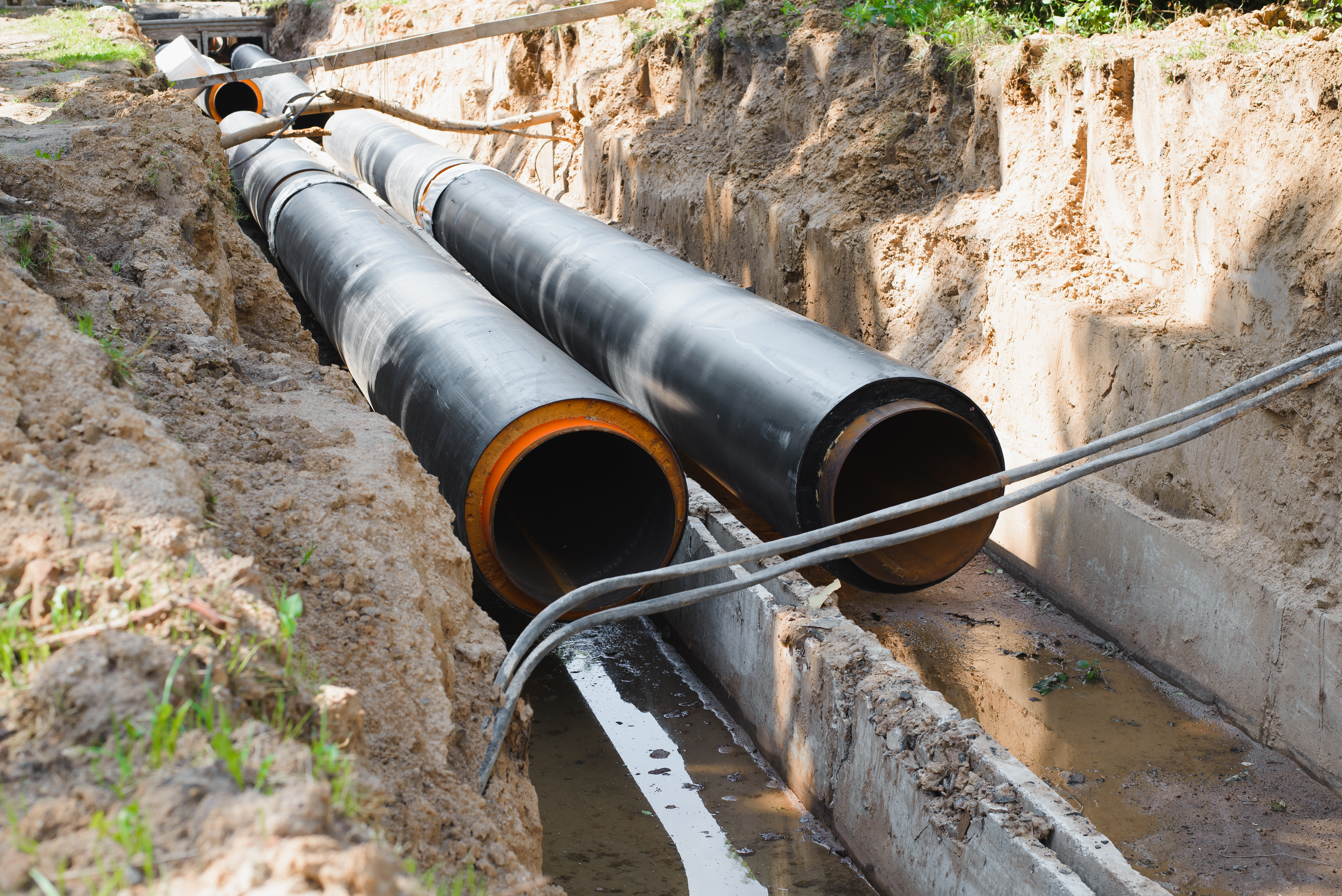 Steel water supply pipes in trench during slip lining rehabilitation project